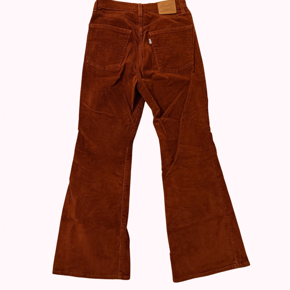 Rusty red corduroy levi flares